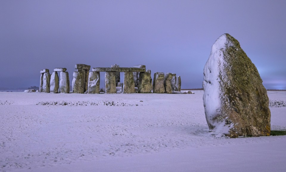 Snow started to fall at Stonehenge in Wiltshire yesterday evening