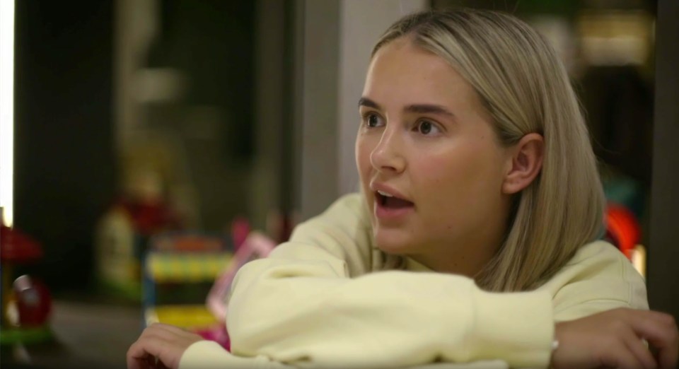 Screenshot of a young woman speaking.