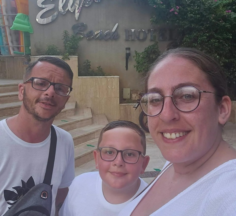 Family in front of Elysium Beach Hotel.