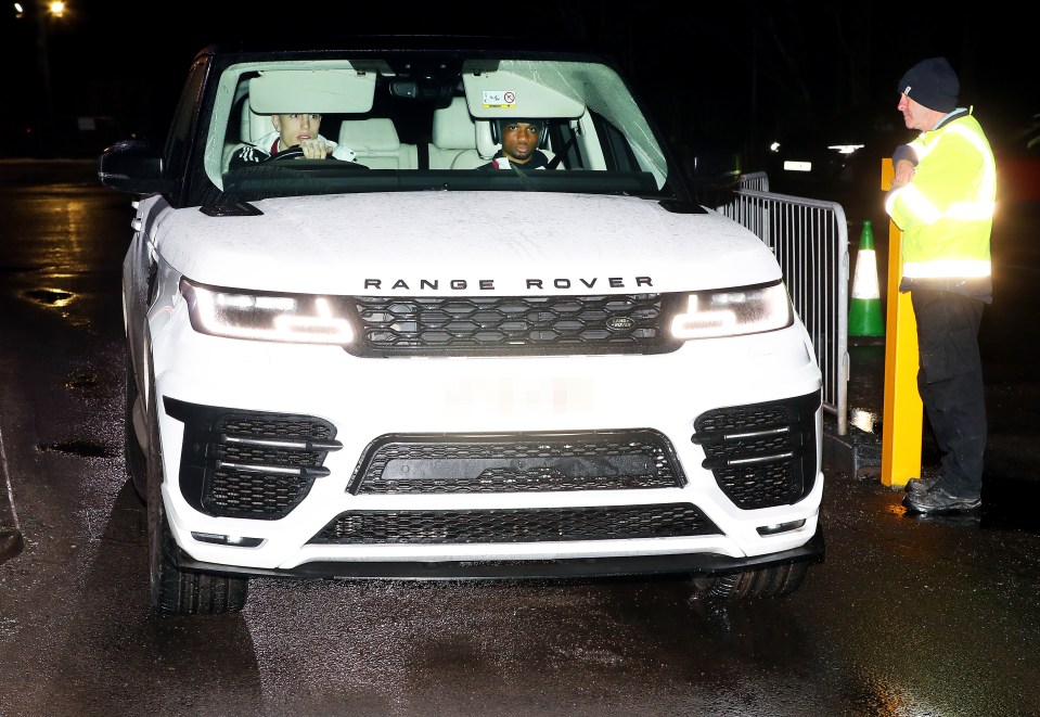 Alejandro Garnacho and Amad in a white Range Rover.