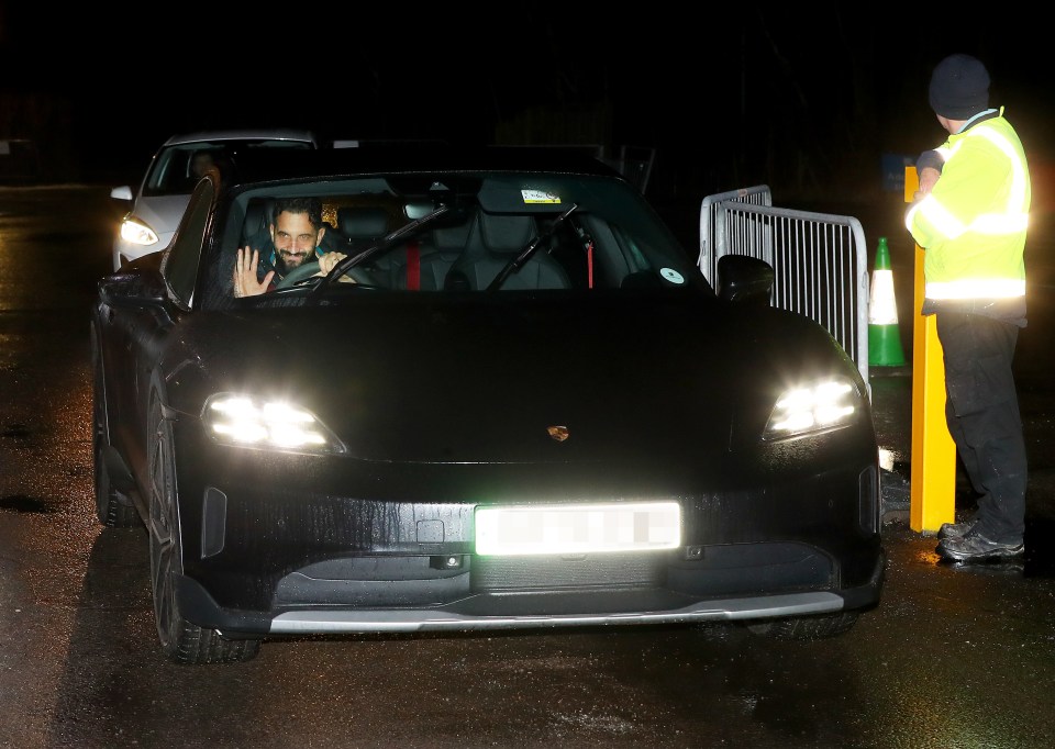 Ruben Amorim waving from his Porsche Taycan.