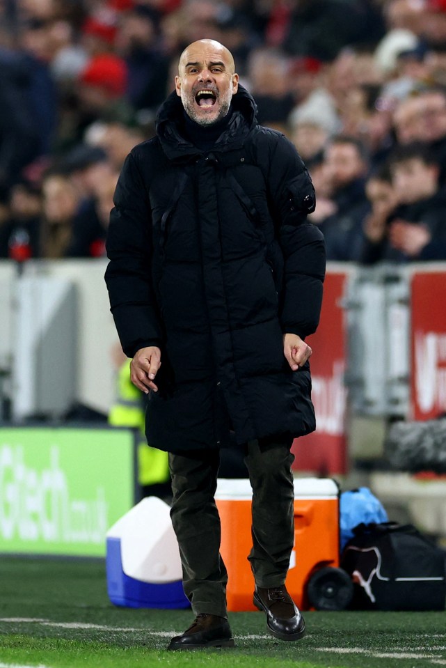 Pep Guardiola reacting during a soccer match.