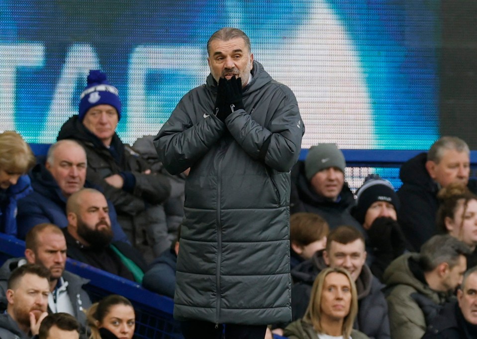 Ange Postecoglou, Tottenham Hotspur manager, looking concerned during a soccer match.