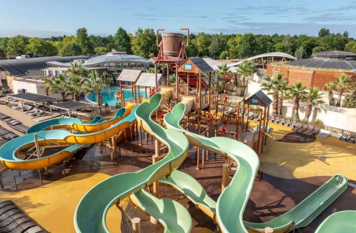 Aerial view of a water park with slides and a playground.