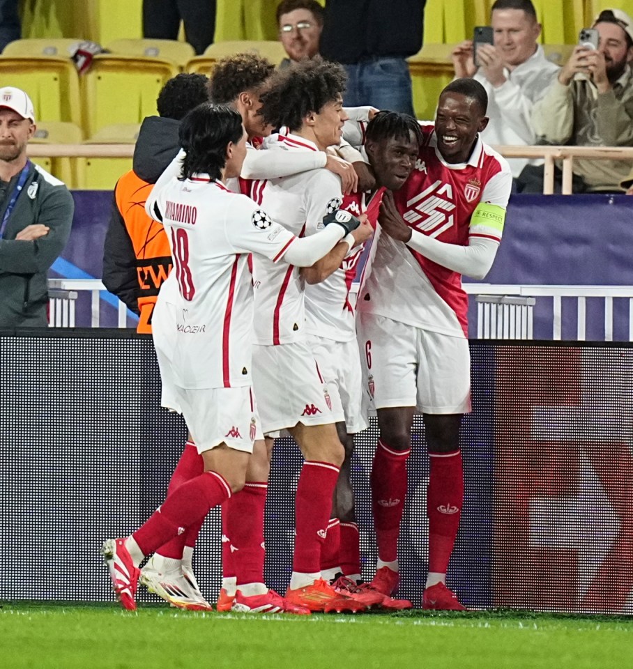 Monaco soccer players celebrating a goal.