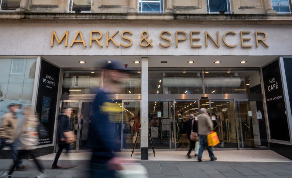 Marks & Spencer store entrance with shoppers.