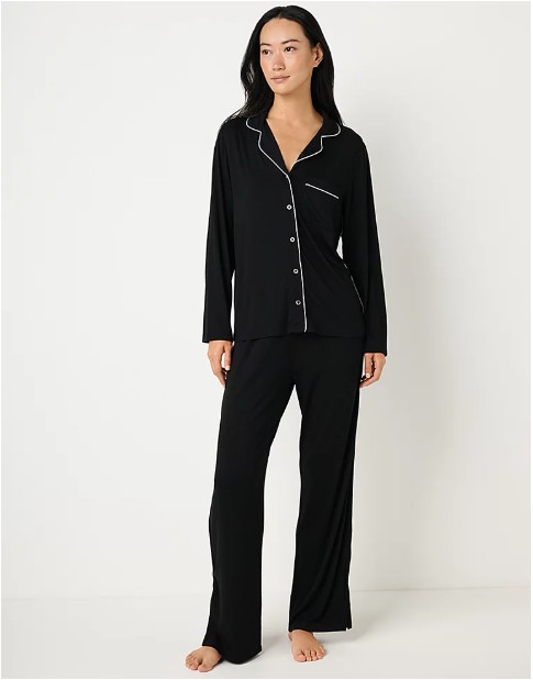 Woman in black pajama set.