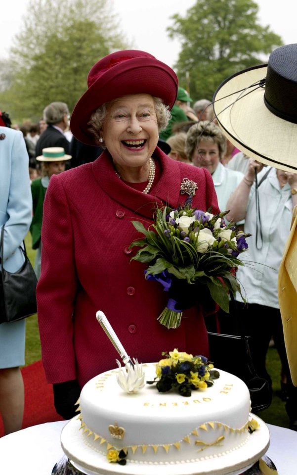 Queen Elizabeth II cutting a Jubilee cake.