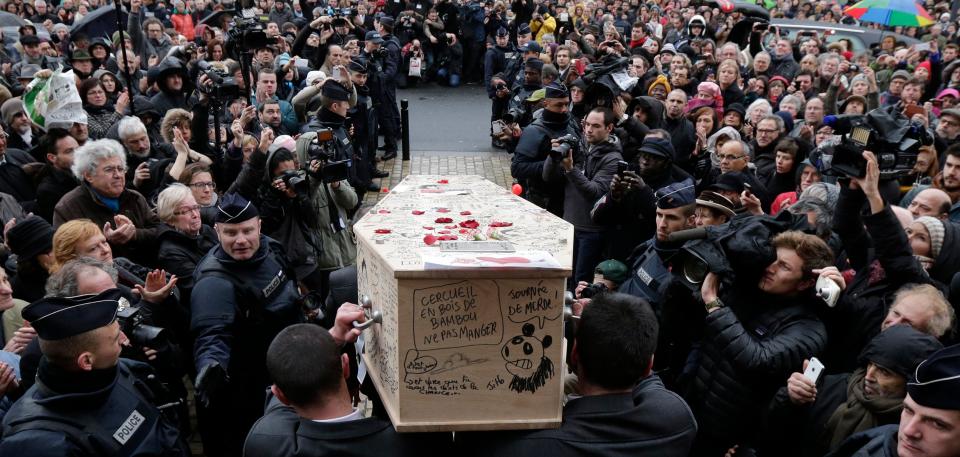 Pallbearers carry the coffin of late satirical French magazine Charlie Hebdo cartoonist Bernard Verlhac, known as Tignous