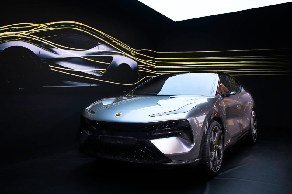 A silver Lotus Eletre electric car on display.