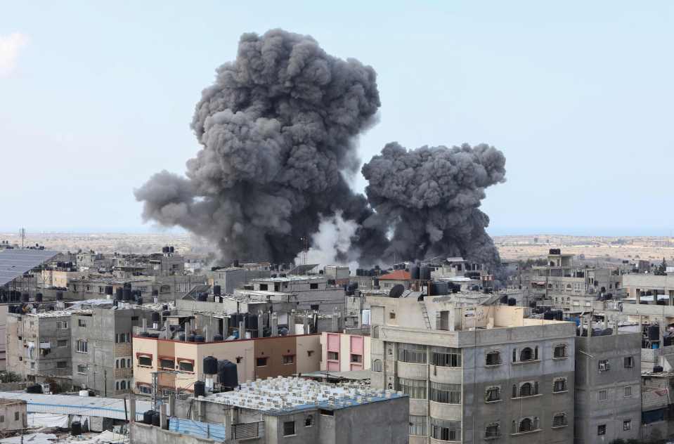 Smoke billows over buildings in Rafah, Gaza, following an Israeli air strike.