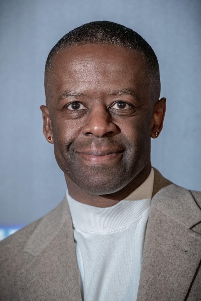 Headshot of Adrian Lester.