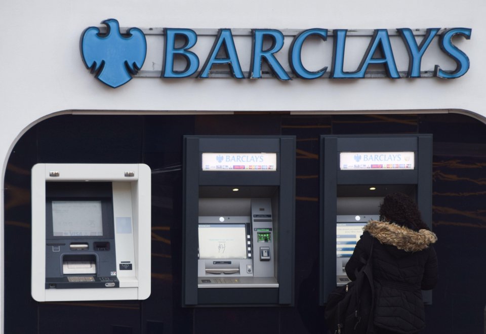 Person using a Barclays ATM.