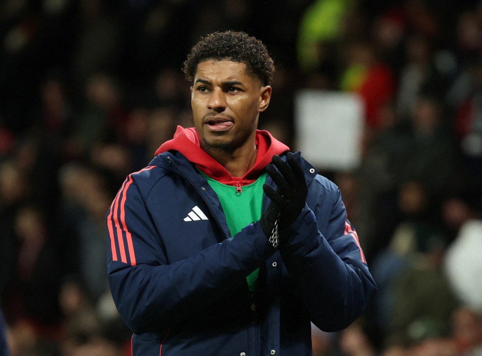 Marcus Rashford looking dejected after a soccer match.