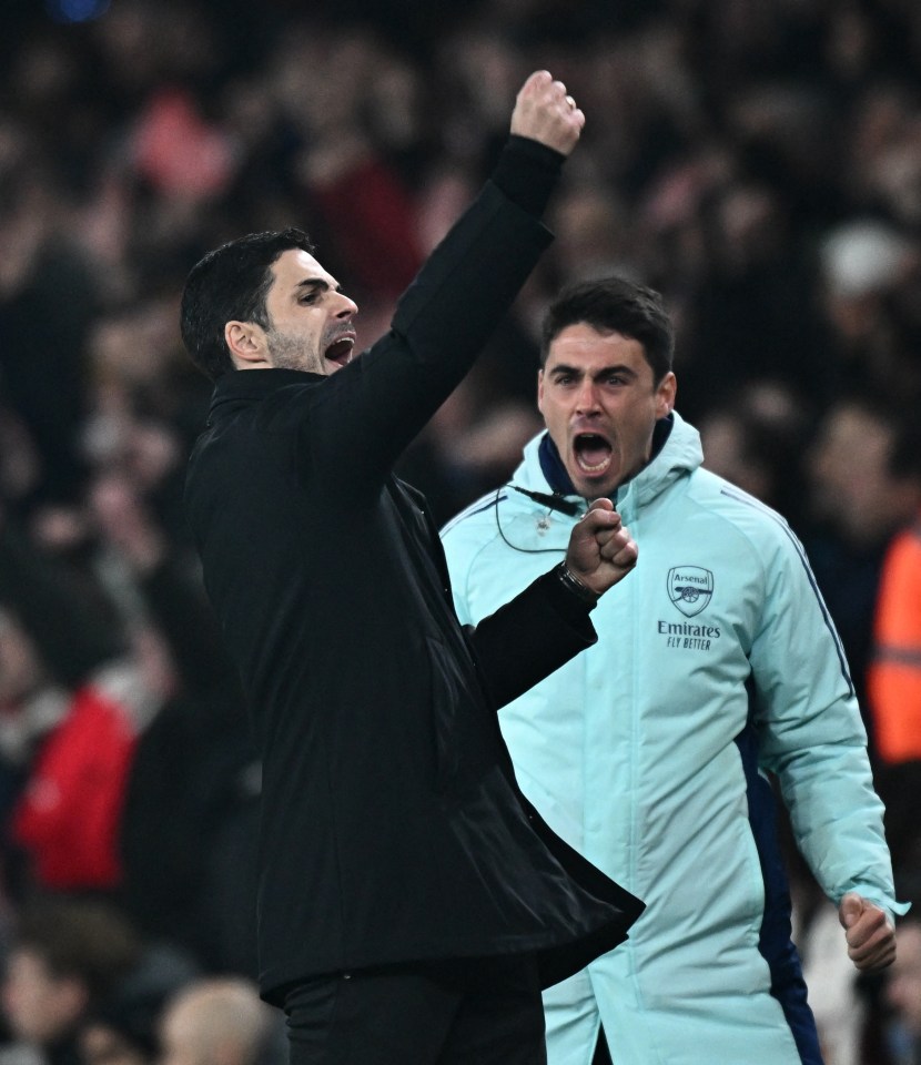 Mikel Arteta and another Arsenal coach celebrating.