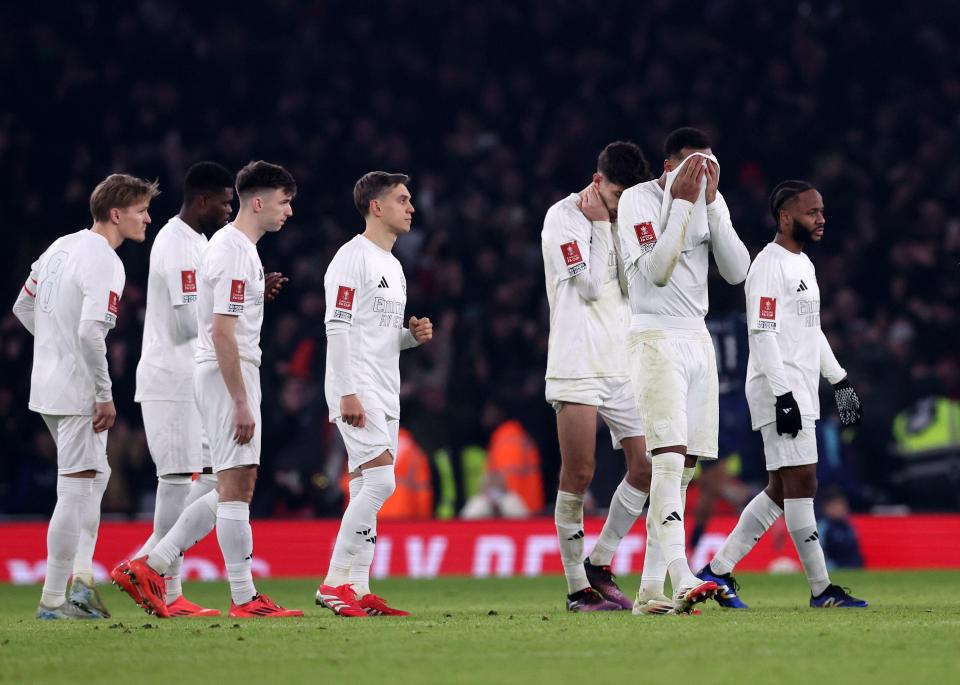 Dejected Arsenal players after an FA Cup loss.