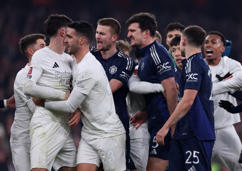 Arsenal's Kai Havertz and Manchester United players clashing after a penalty.