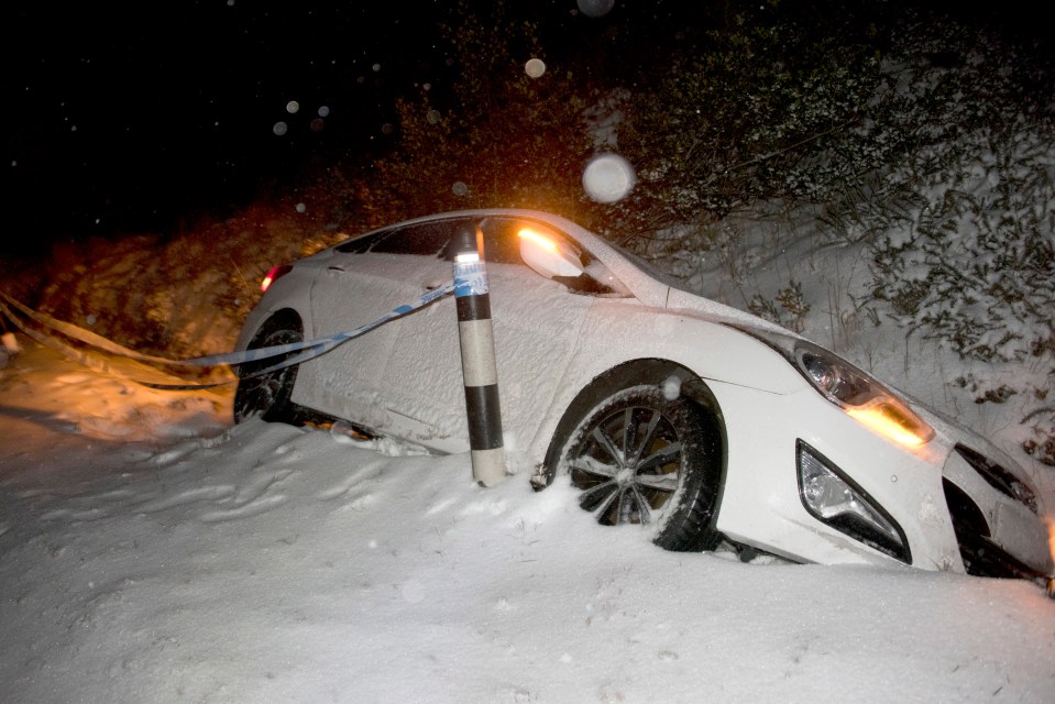 A car slides off the road in Powys, Wales