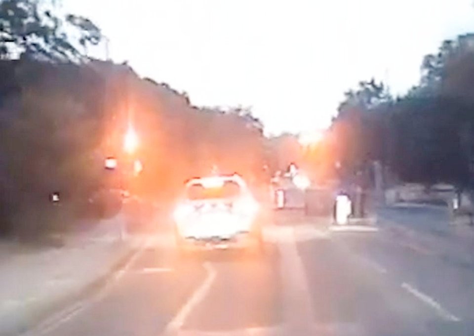 Dashcam footage of a high-speed police chase.