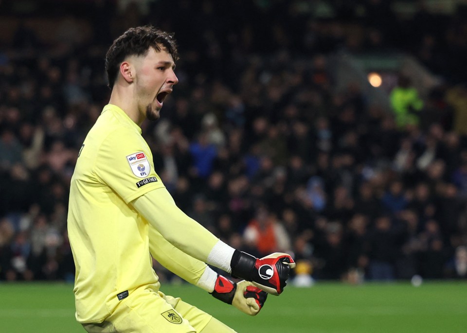 Burnley's James Trafford celebrates after saving a penalty.