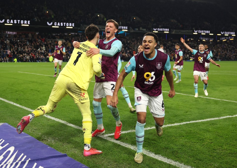 Burnley soccer players celebrating a goal.