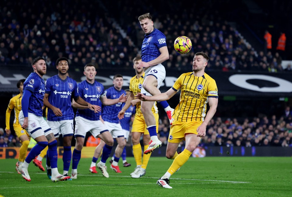 Liam Delap of Ipswich Town and Adam Webster of Brighton & Hove Albion vying for the ball.