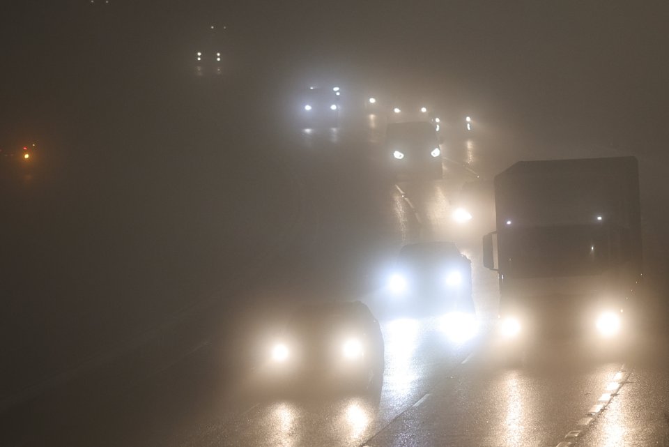 Traffic in dense fog.