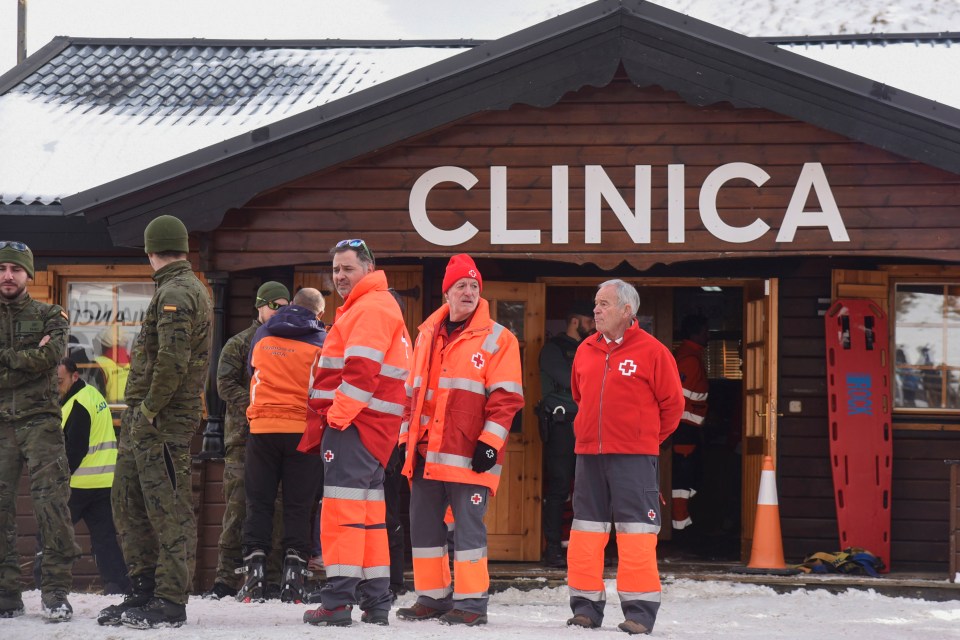 Emergency personnel outside a ski resort clinic after a chairlift accident.