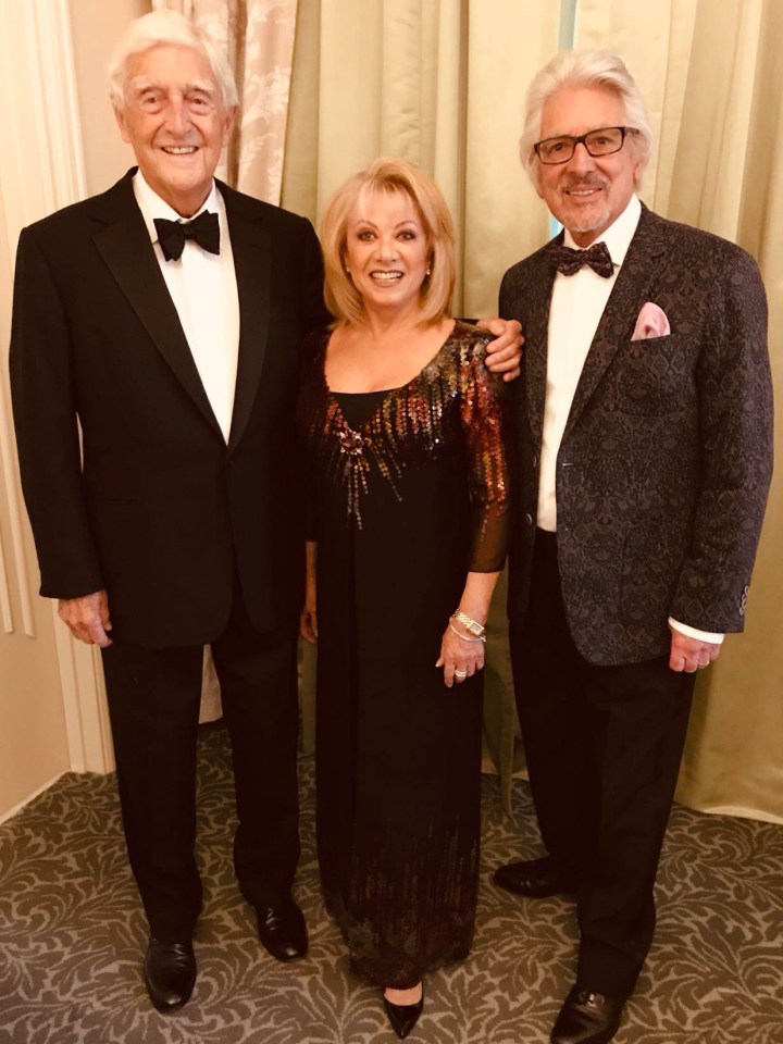 Laurence Holloway with Sir Michael Parkinson and another woman.