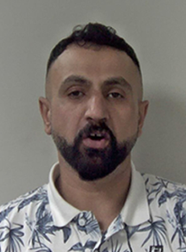 Mugshot of Dlawar Omar, a member of a UK-based people-smuggling gang.