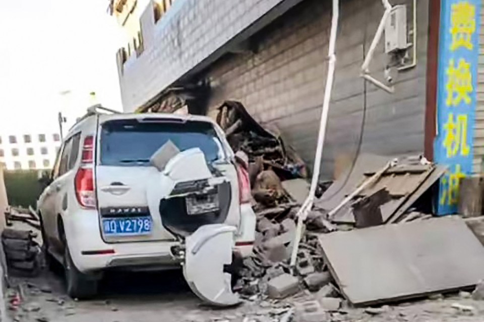 Buildings crumbled as cars were also left destroyed