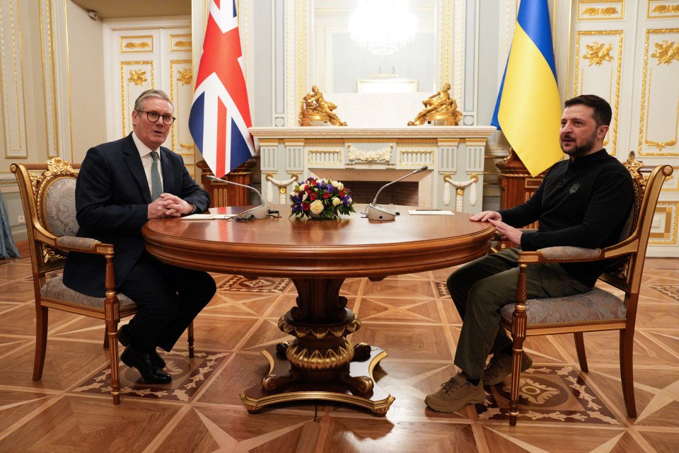 Keir Starmer and Volodymyr Zelenskyy meeting at a table.