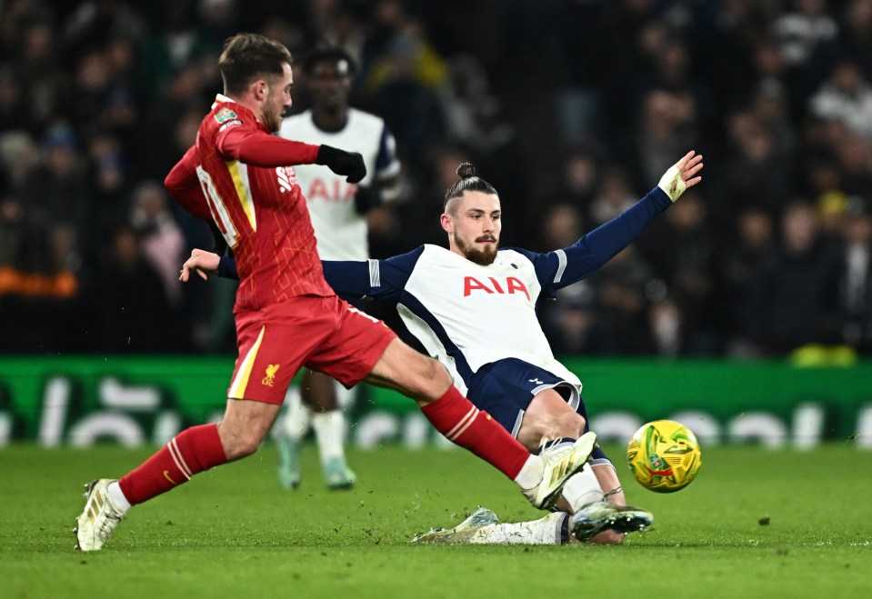 Radu Dragusin of Tottenham Hotspur vies for the ball.