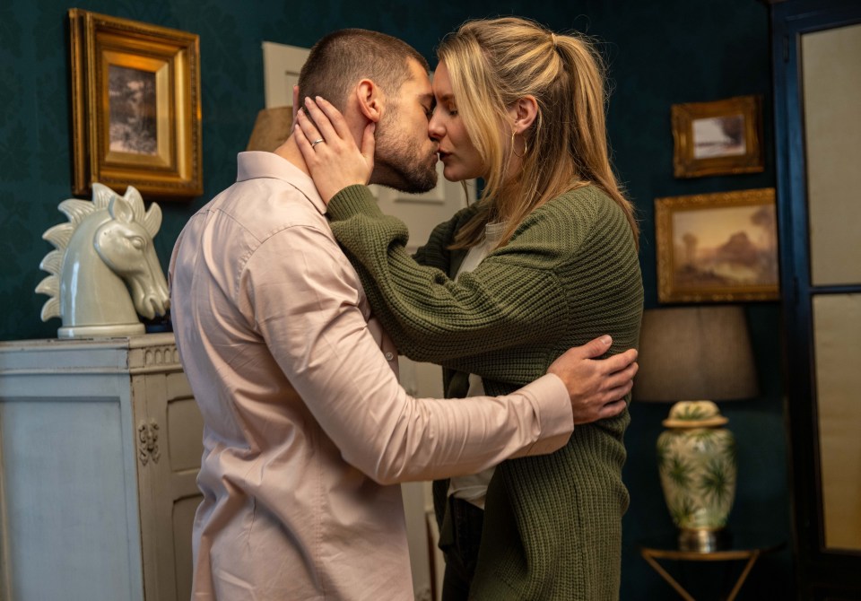 Joe Tate and Dawn Fletcher kissing passionately.