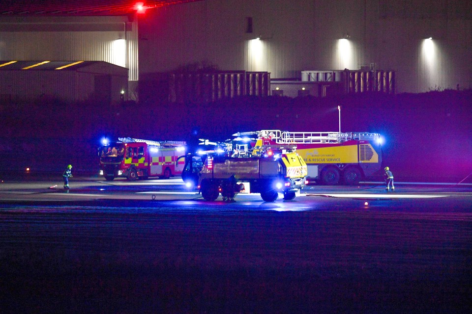 Emergency vehicles at Belfast City Airport runway after a plane incident.