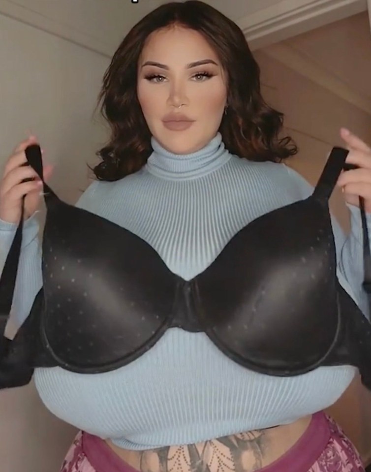 Woman comparing a DD bra to her own much larger breast size.