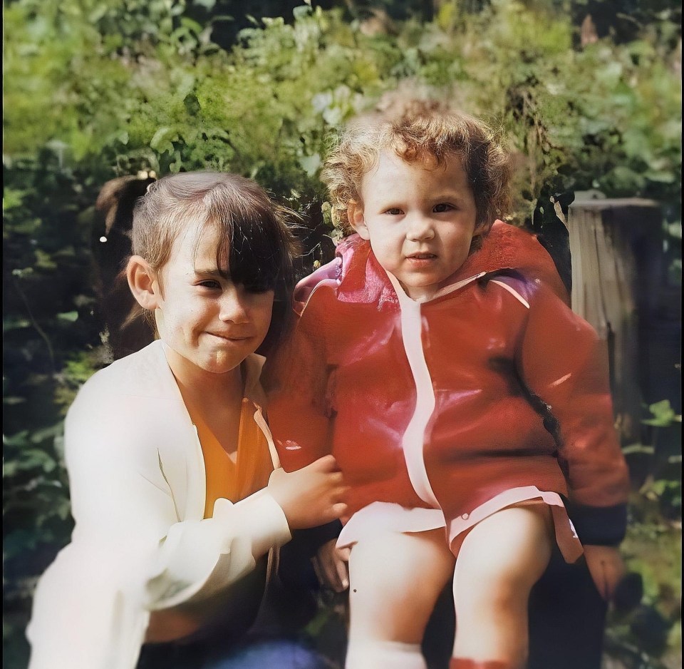 Photo of two young sisters outdoors.