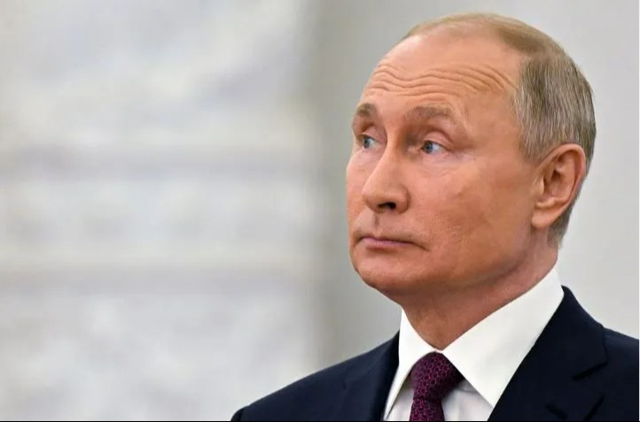 Headshot of Vladimir Putin.