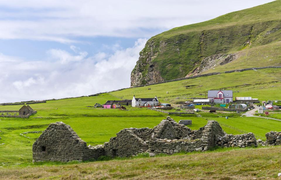 Hametown settlement ruins and modern buildings on Foula Island, Shetland.