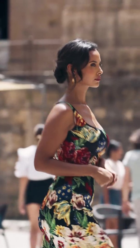 Maya Jama in a floral dress for a Dolce & Gabbana perfume ad.