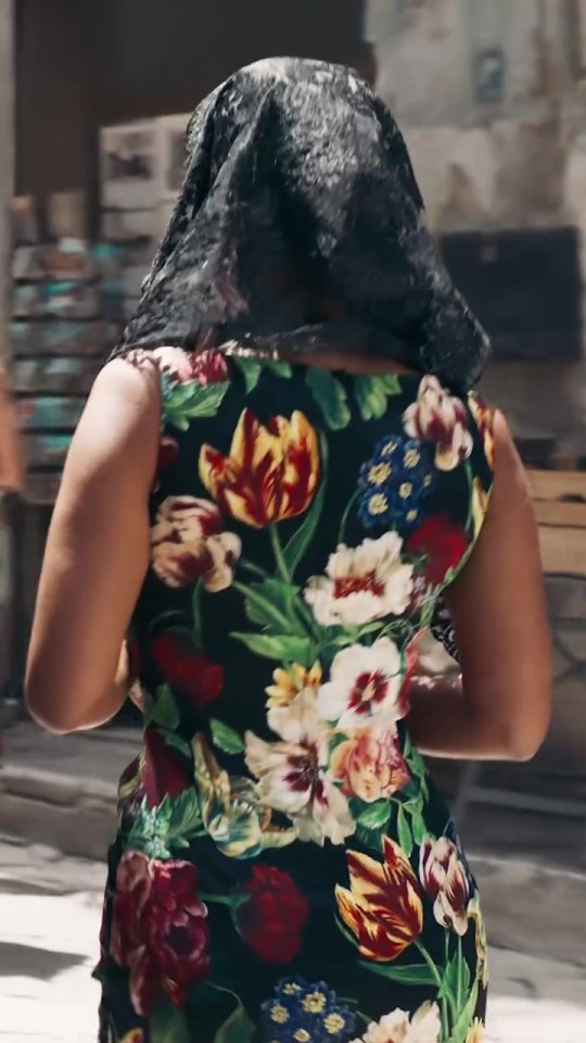 Maya Jama in a Dolce & Gabbana floral dress and black veil.