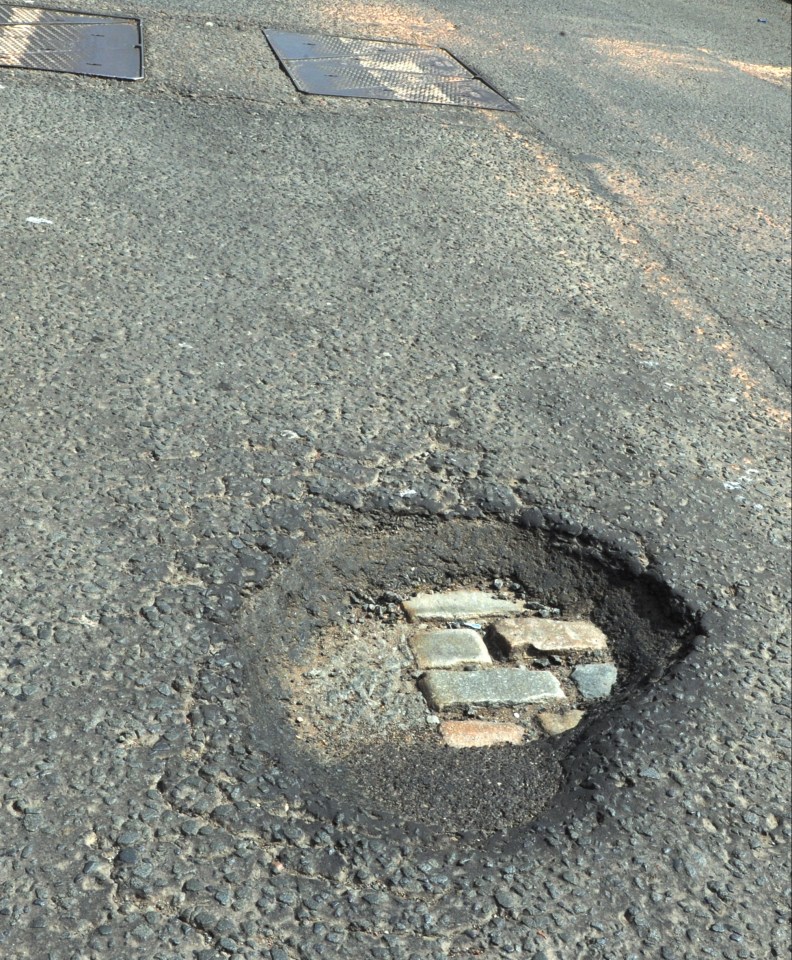 Pothole in a road surface.