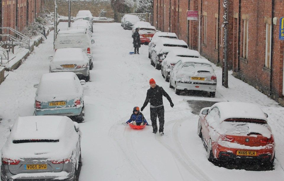 People in Hexham, Northumberland, enjoying the snow this morning