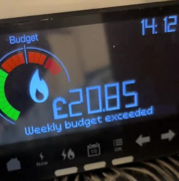 Smart meter display showing weekly energy budget exceeded.