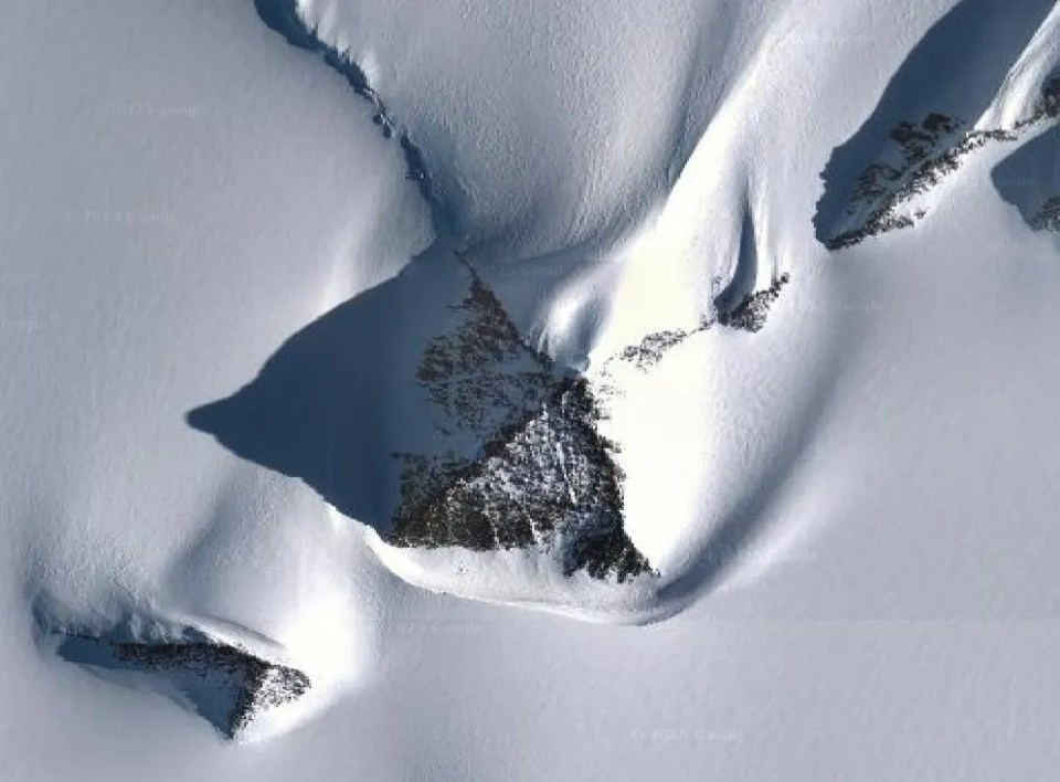 Aerial view of a pyramid-like structure in the Antarctic.