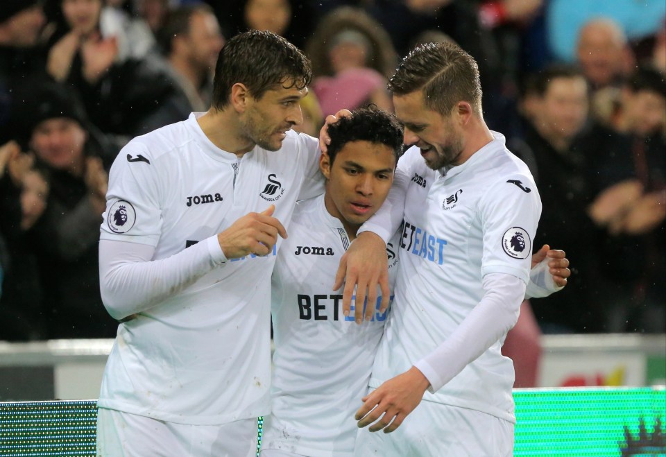 Swansea City players celebrating a goal.