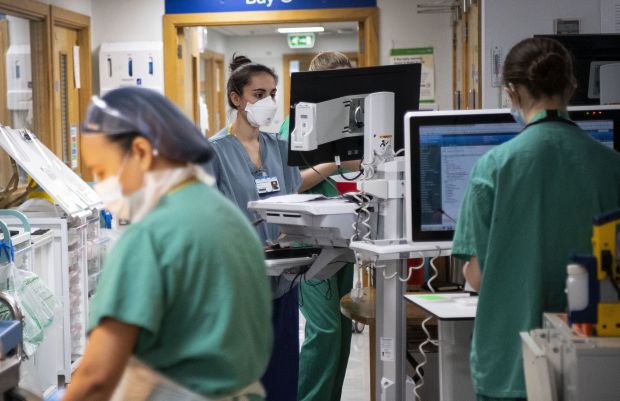 Hospital nurses working at computer stations.