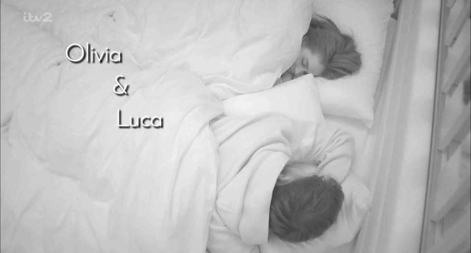 Olivia and Luca asleep in bed.