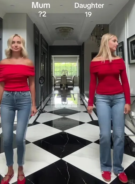 Two women, a mother and her 19-year-old daughter, wearing similar outfits, standing in a hallway.