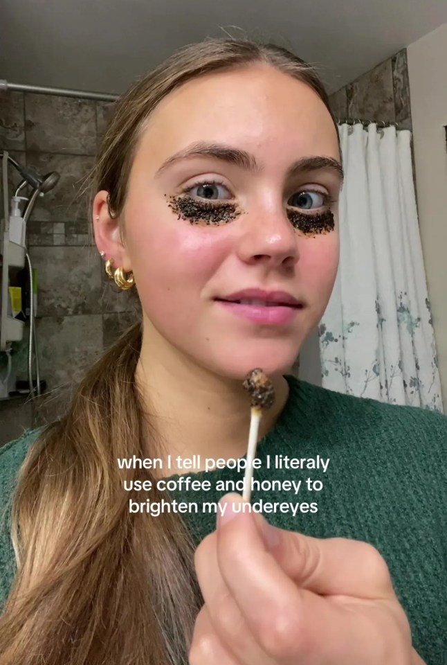 Woman applying coffee and honey under her eyes.